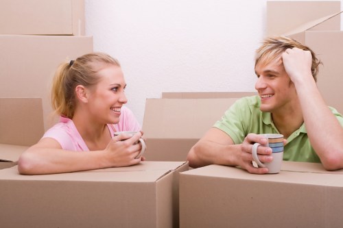 Moving team handling boxes safely during a Hadley Wood van service