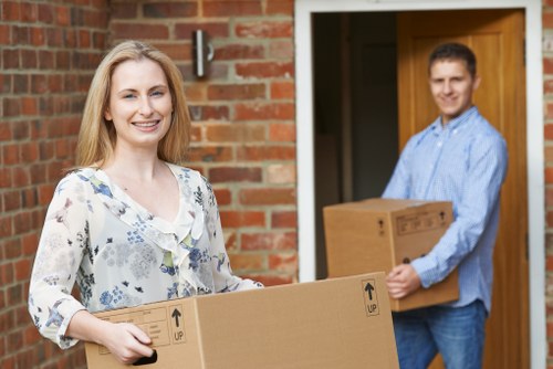 Packed moving boxes and furniture prepared for transport in Hadley Wood
