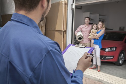 Furniture and boxes being loaded into a removals van
