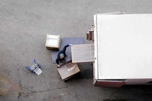 Removal workers loading furniture for a move near Hadley Wood