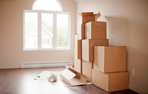 Moving crew handling a family house relocation in Hadley Wood with protective care