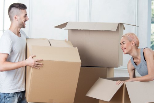 Careful handling of a fragile item during a professional removals job